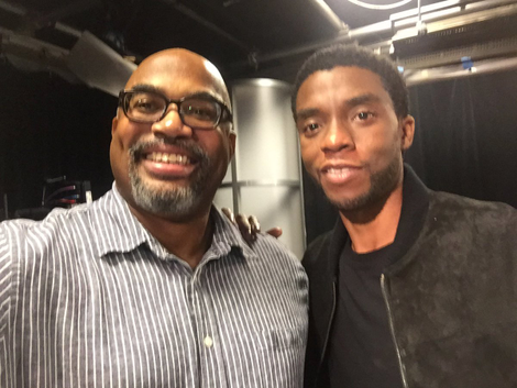Jesse Holland with lead actor Chadwick Boseman (Twitter)